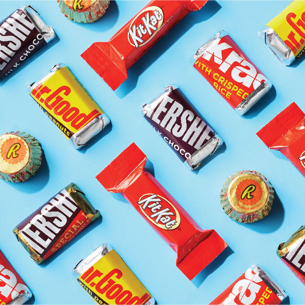 Assorted Hershey's, Kit Kat and Reese's candy in a fun, repeating pattern