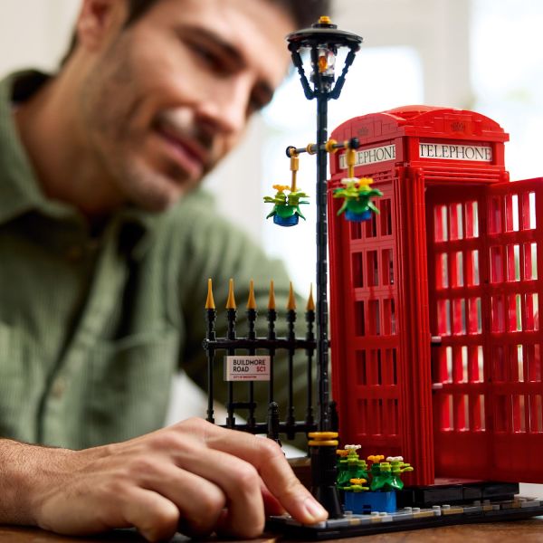 Build a cobbled street, lamppost, fence and street sign.