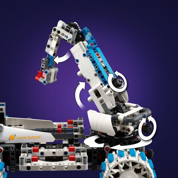 Use the arm to lift the smaller mining rover.