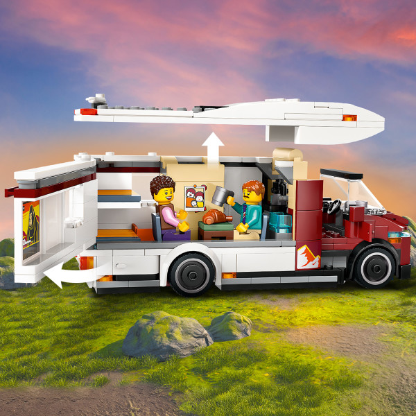 The camper van opens for full access to its modern interior.