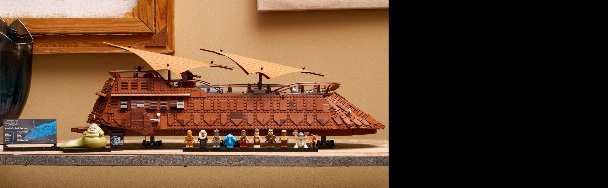 Use advanced LEGO building techniques to recreate the barge and add 8 LEGO Star Wars minifigures and 3 other characters.