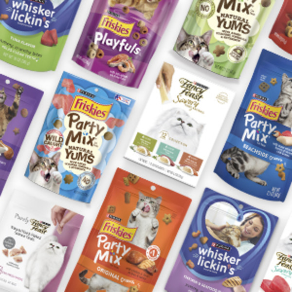 A selection of Friskies cat treats packages is arranged in rows.