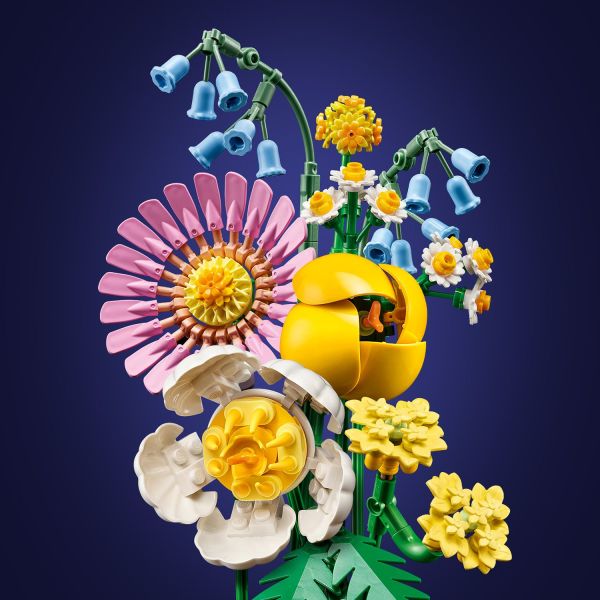 Includes bluebells, a pink gerbera and a yellow tulip.