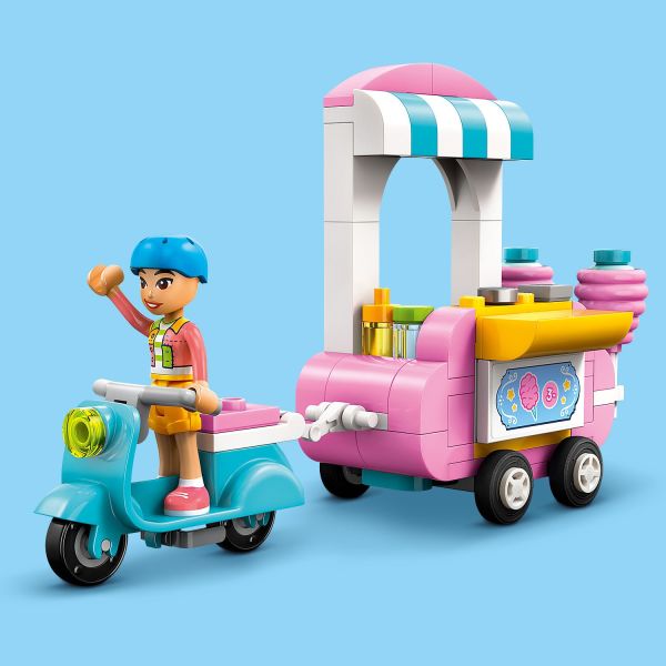 Use the scooter to steer the mobile food cart into position.