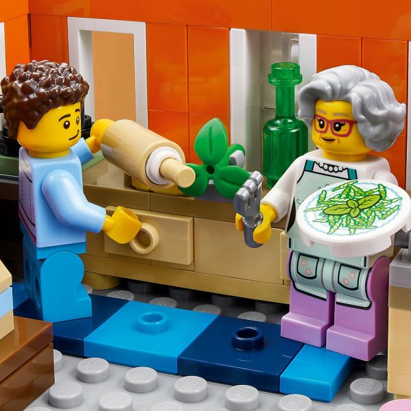 A nonna shows her grandchild how to make trofie pasta.