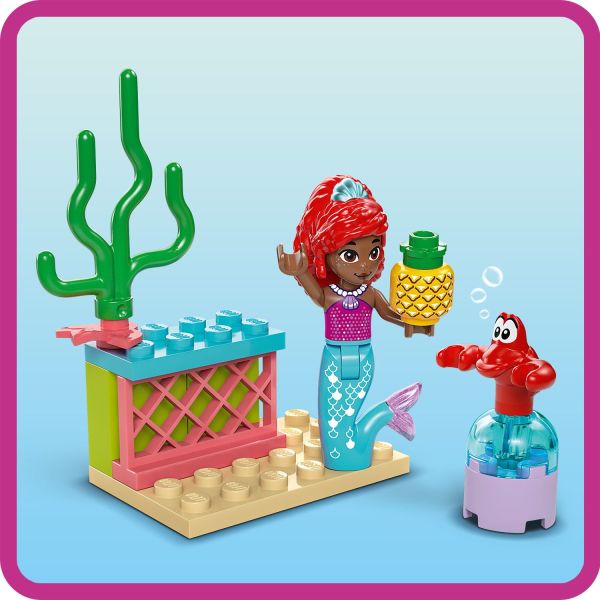 The refreshment area has a chair, counter and pineapple.