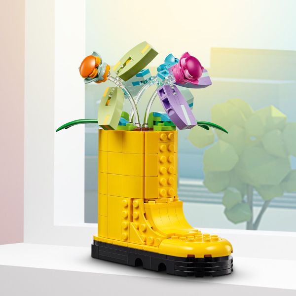 Yellow boot also features 3 flowers with movable petals.
