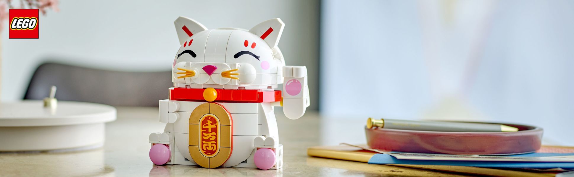 Assemble a Lucky Cat model with authentic details including a beckoning paw, smiling eyes, whiskers and blushing cheeks.