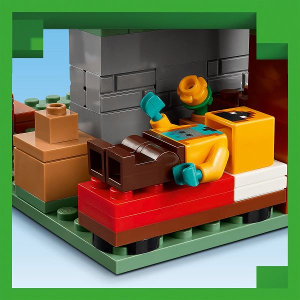 A room at the rear is equipped with a bed and table.