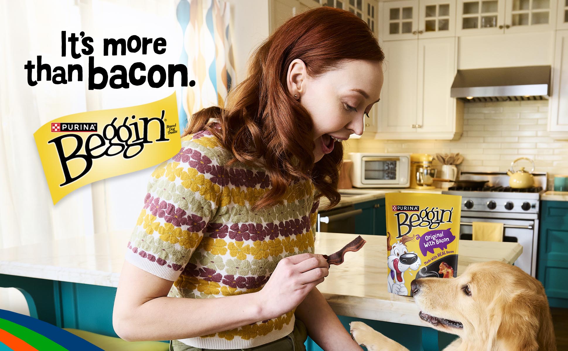 Woman by a kitchen island treating a golden retriever with a Beggin’ Strip. There’s a bag or Original Flavor Beggin’ Strips on the counter with the headline, “It’s more than bacon.”
