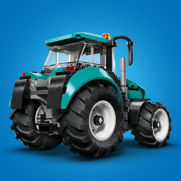 Features a teal color scheme and 4 big tractor tires.
