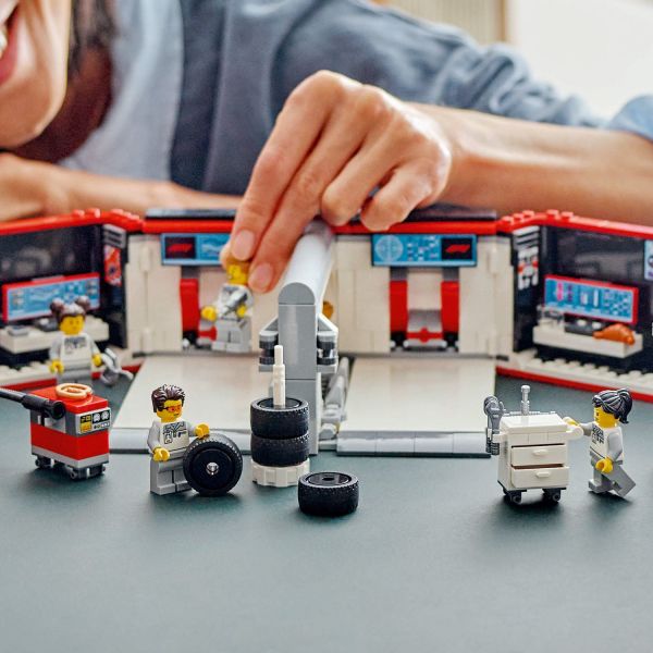 Includes workbenches, tool carts and a tower of slick tires.