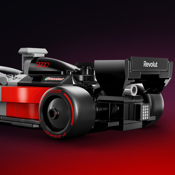 Includes a rear wing and sponsor logos.