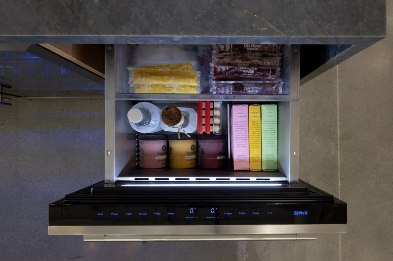 Removable silicone drawer mats cushion bottles, secure contents and provide easy cleanup.