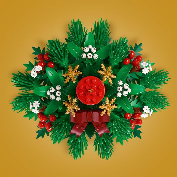 A red candle sits at the center of the decoration.