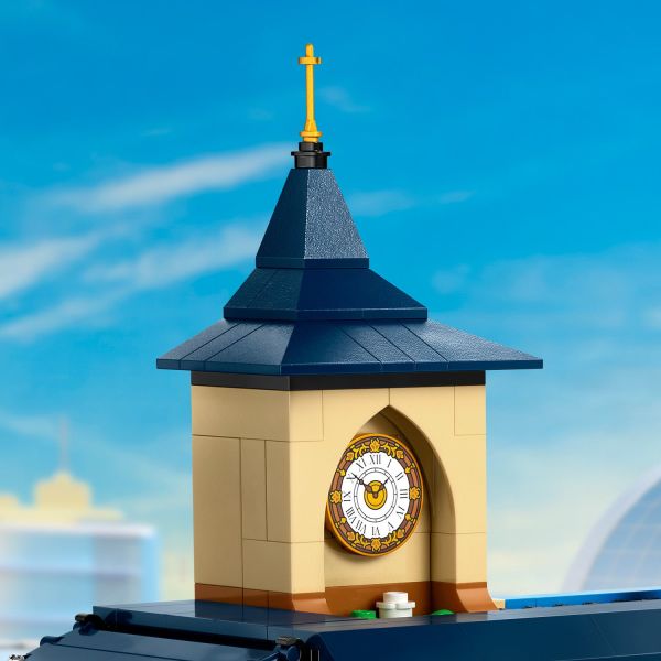 Modern train station is topped with an iconic clock tower.