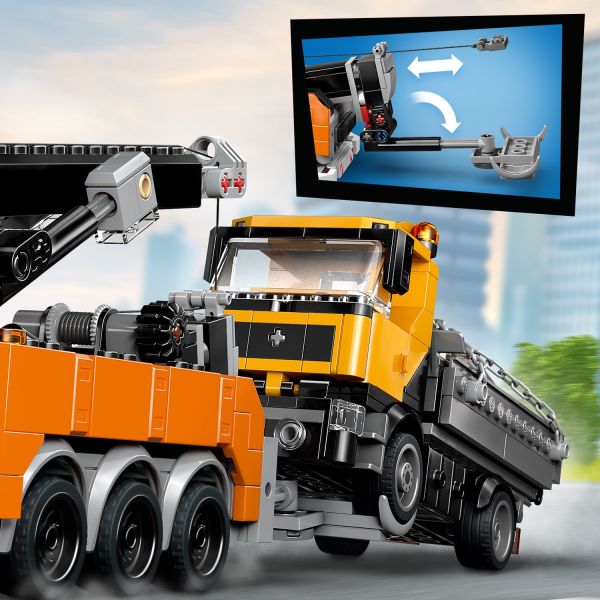 Operate the underlift and winch to load the dump truck for towing.