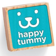 A blue building block features a smiling puppy face illustration and the words Happy Tummy.
