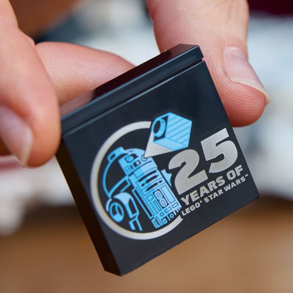 Includes a LEGO Star Wars 25th anniversary brick.