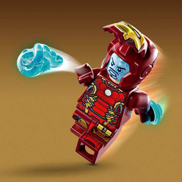 Iron Man has an opening visor and holds a power blaster.