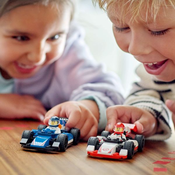 Includes 2 realistic F1 race car toys with slick tires.
