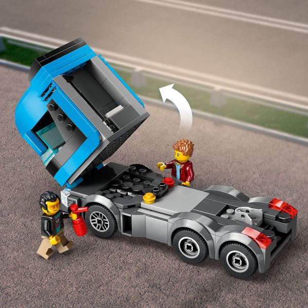 Tilt the driver’s cab to view the truck’s engine.