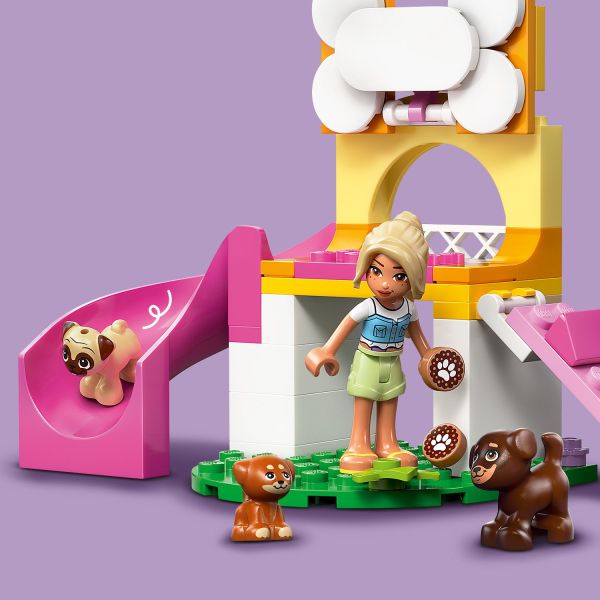 The cute puppies love to ride down the slide.